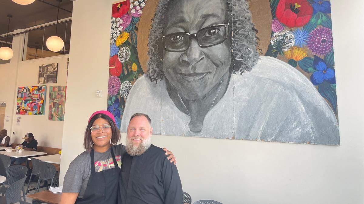 Thelma’s Kitchen head chef Natasha Bailey with Reconciliation Services CEO Father Justin Mathews.