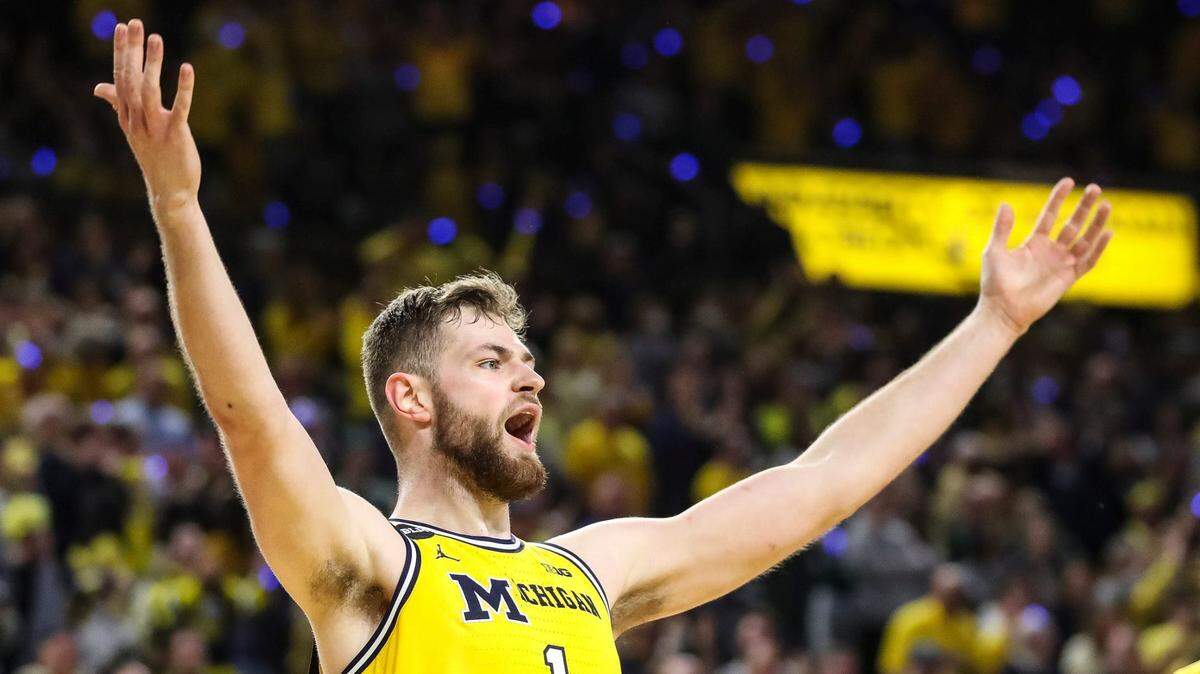 Michigan center Hunter Dickinson (1) celebrates a three-point basket against Michigan State during the second half at Crisler Center in Ann Arbor on Saturday, Feb. 18, 2023.