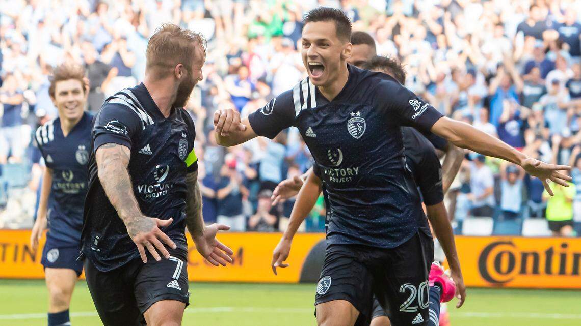 Sporting Kansas City forward Daniel Salloi celebrates with Sporting Kansas City forward Johnny Russell (left) and teammates after scoring the winning goal during the match between Sporting Kansas City and Los Angeles FC on Saturday June 26, 2021 at Children’s Mercy Park in Kansas City, Kansas.