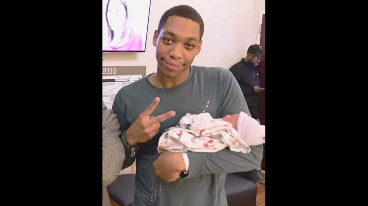 Cameron Douglas is pictured holding his daughter shortly before he was killed.