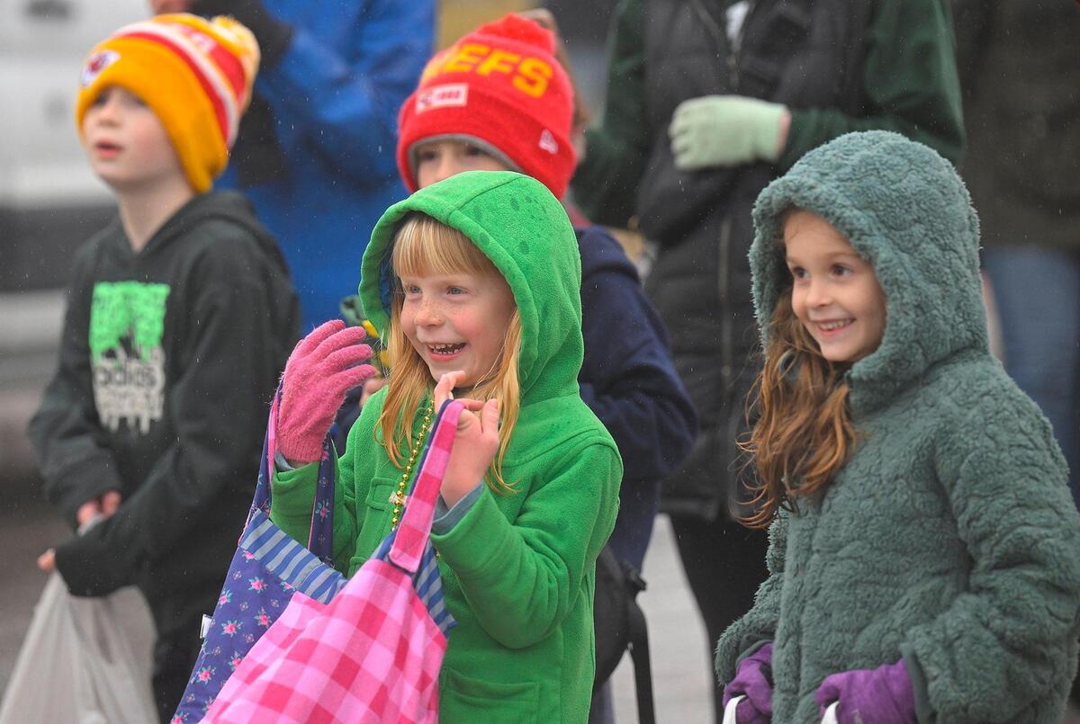 Ophelia Davis, 6, and Fallon Burton, 7, both of Kansas City, delighted in seeing balloon lephrechauns in the 2023 Brookside St. Patrick’s Day Warm-Up Parade on Saturday March 11, 2023 in Kansas City.