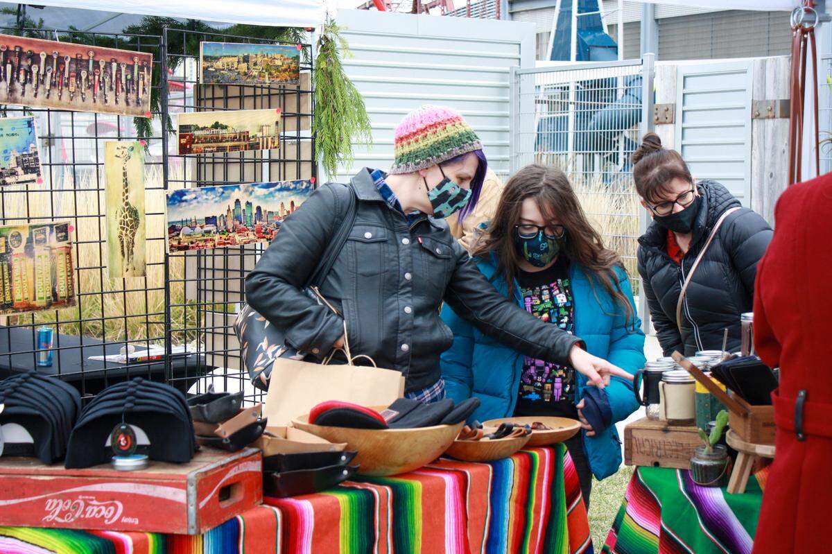 Shoppers browse at this year’s Strawberry Swing Indie Craft Fair’s Holiday Market. Normally held inside Union Station, the annual event was moved outside and scaled down to help support local artists who have struggled throughout the coronavirus pandemic.