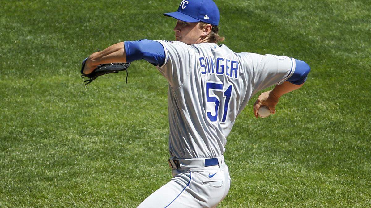Kansas City Royals starting pitcher Brady Singer throws to the Minnesota Twins in the first inning of a baseball game Sunday, Aug. 16, 2020, in Minneapolis. (AP Photo/Bruce Kluckhohn)
