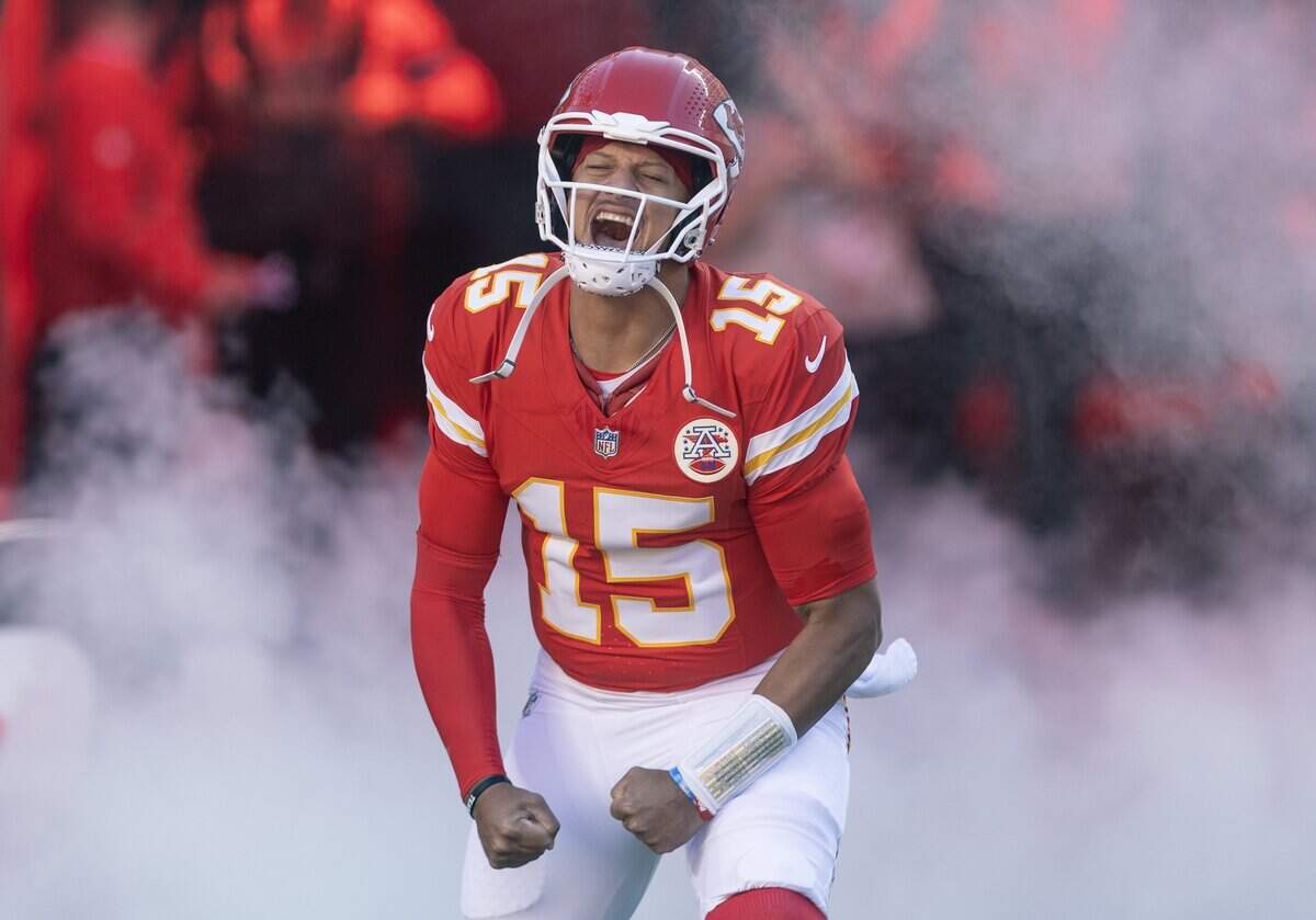 Kansas City Chiefs quarterback Patrick Mahomes (15) is introduced before the start of their game against the Los Angeles Chargers on Sunday at Arrowhead Stadium.