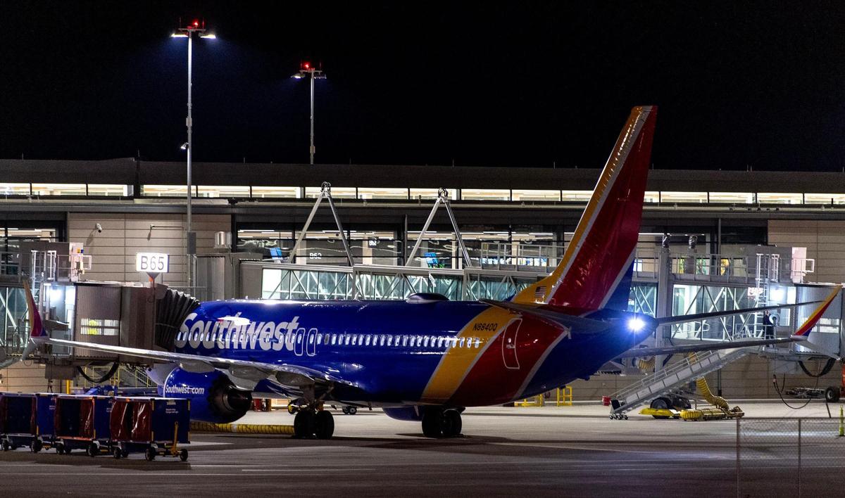 A Southwest Airlines plane sits at a gate of the Kansas City International Airport’s new terminal on Monday, Feb. 27, 2023, in Kansas City.