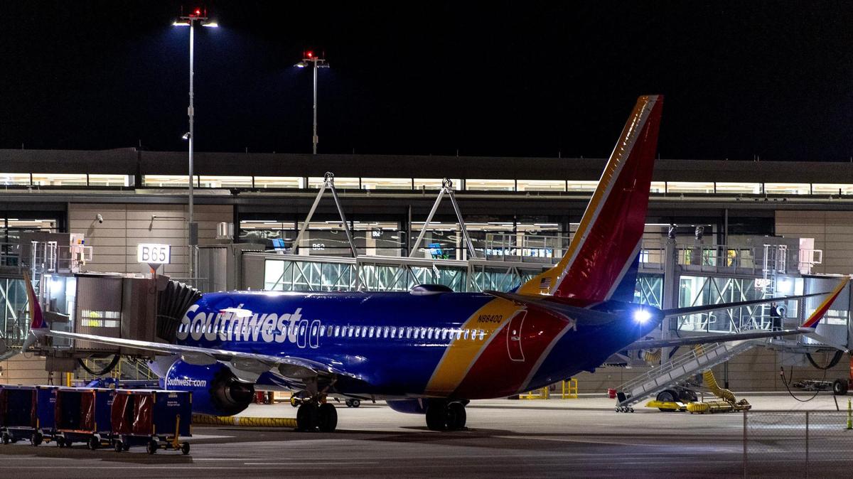 A Southwest Airlines plane sits at a gate of the Kansas City International Airport’s new terminal on Monday, Feb. 27, 2023, in Kansas City.