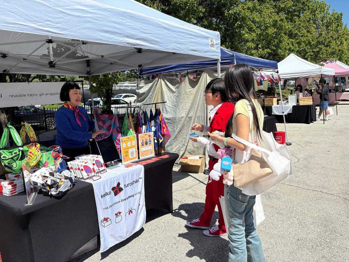 Keiko Kira demonstrates the art of furoshiki, which uses a folded piece of cloth to hold items.