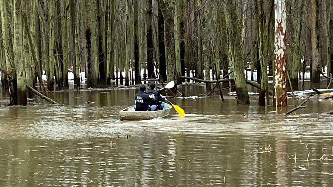 Police tracked the man using a drone before pulling him from the river and into a canoe, cops say. The man threatened to kill his ex. 