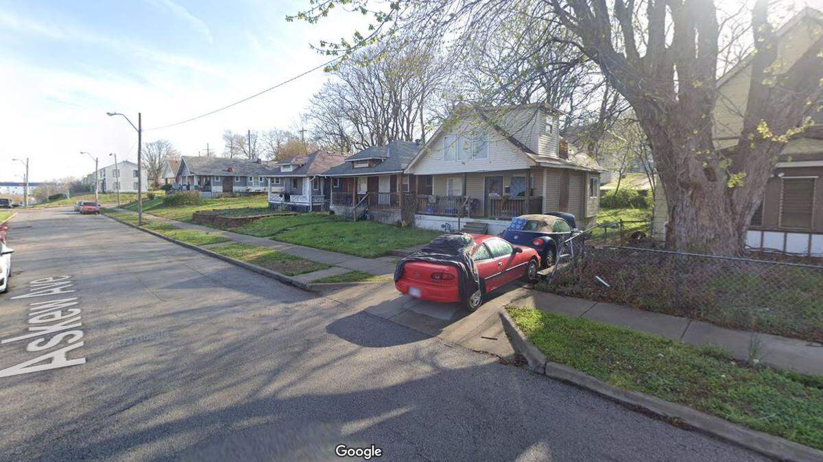 Two homes sustained extensive damage when an early morning fire at one house spread to the other in the 2300 block of Askew Avenue of Kansas City, a fire department spokesman said Monday. This Google Maps Street View image of the neighborhood is from April.