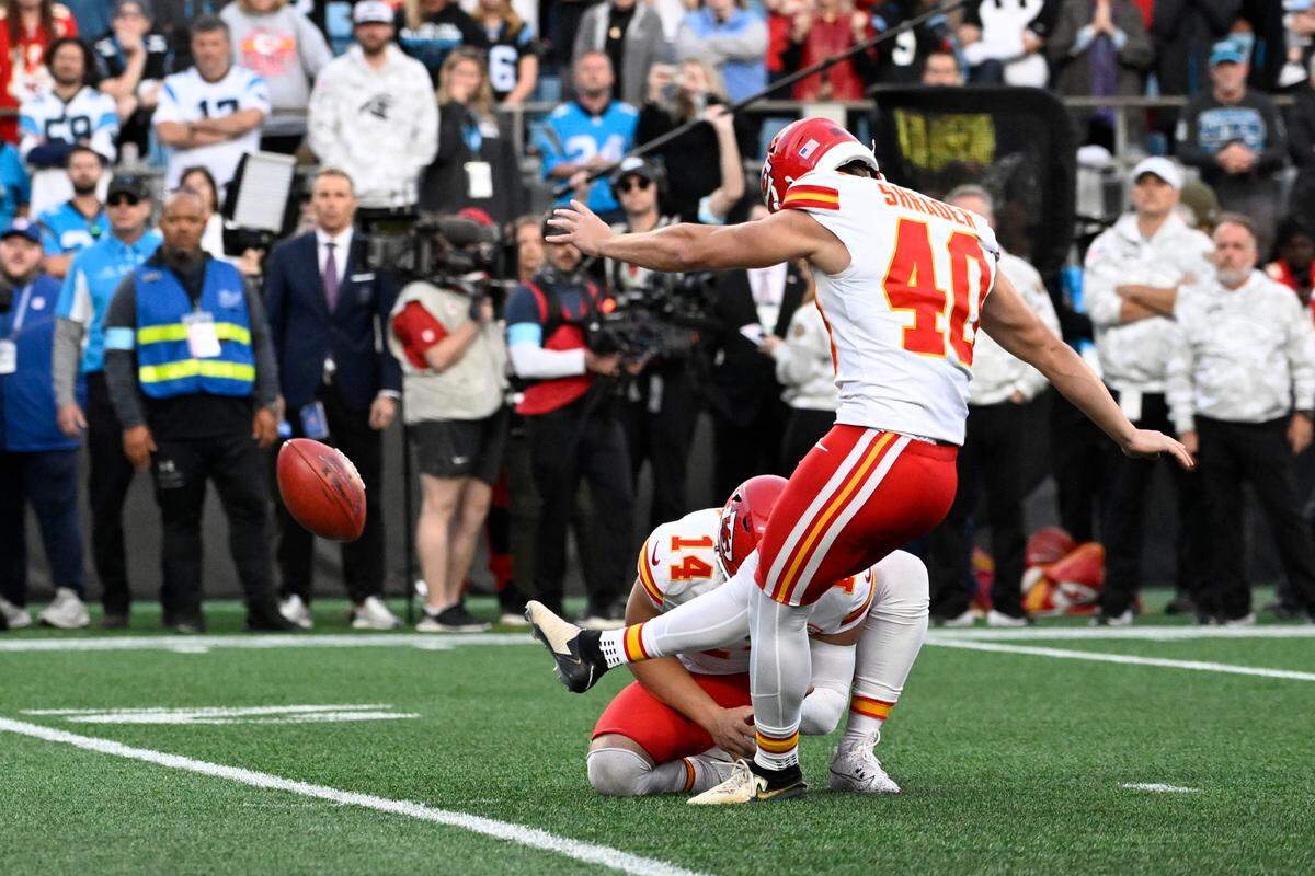 Kansas City Chiefs place kicker Spencer Shrader (40) kicks the winning field goal at the end of the game at Bank of America Stadium.