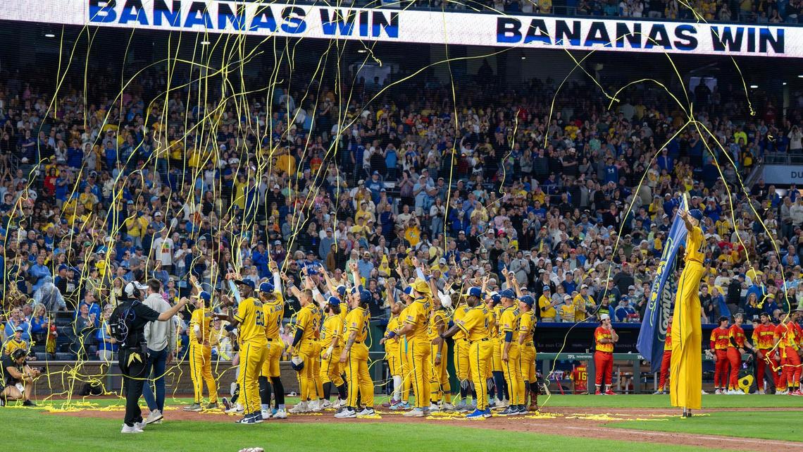Savannah Bananas players celebrate after defeating the Firefighters during a Banana Ball game at Kauffman Stadium on May 23, 2025, in Kansas City.