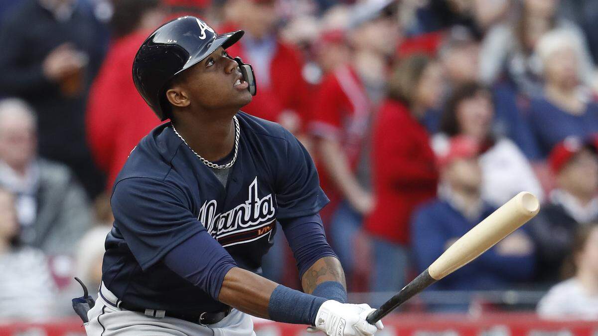 The Braves' Ronald Acuna Jr. flied out against the Reds' Brandon Finnegan in his first major-league at-bat in the first inning Wednesday in Cincinnati.