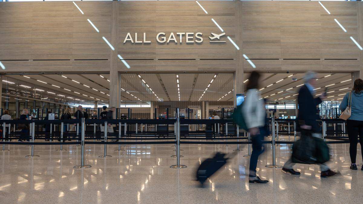 Travelers arrive at the gate entrance at Kansas City International Airport on Tuesday, Feb. 28, 2023.