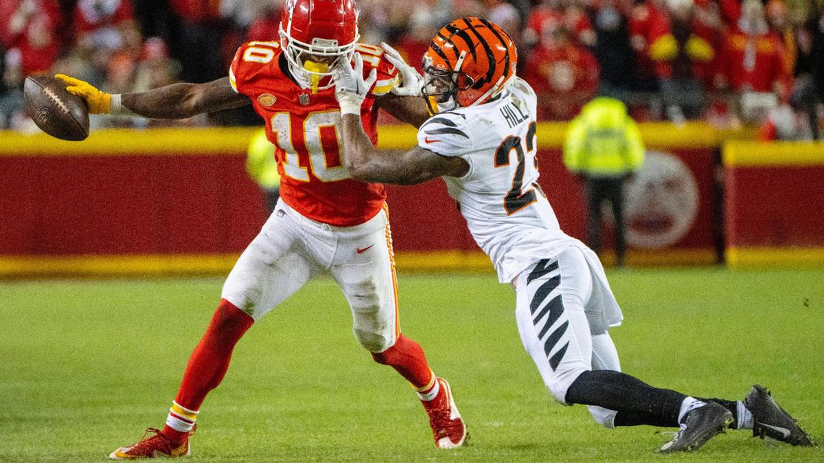 Kansas City Chiefs running back Isiah Pacheco (10) is tackled by Cincinnati Bengals safety Dax Hill (23) in the first half on Sunday, Dec. 31, 2023, at GEHA Field at Arrowhead Stadium.
