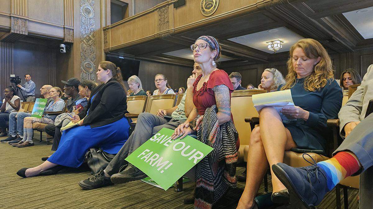 Urbavore’s Brooke Salvaggio, middle, looks on during a Kansas City Council meeting Oct. 3.