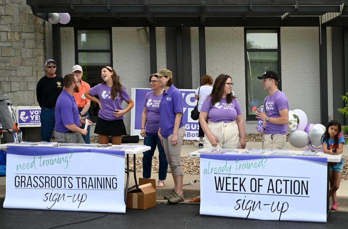 Organizers prepared to sign up volunteers for training or a week of action during the Value Them Both Tailgate and Rosary Rally in Overland Park.