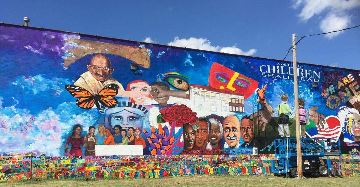 The 130-foot-wide, 30-foot-tall mural is across the street from the old Monroe Elementary School, now the Brown v Board of Education National Historic Site.