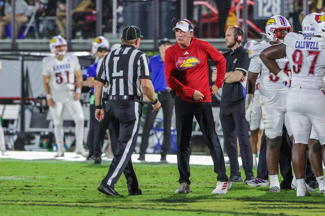 Kansas Jayhawks head coach Lance Leipold talks with an official during the second quarter against the UCF Knights at the Ascrisure Bounce House on Oct. 4, 2025.
