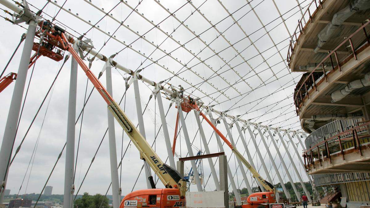 In 2010, welders worked on the supports on the front of the Kauffman Center, which were later covered in glass.
