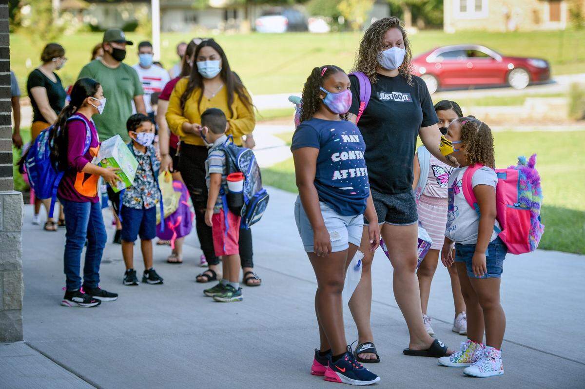 Students arrived for the first day of school Monday at Cassell Park Elementary School in Independence. The district allows grade school kids to attend in person every day.