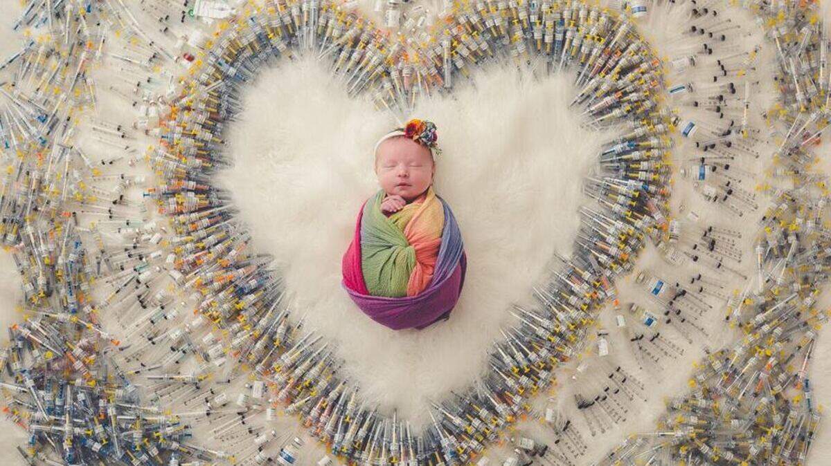 Two Arizona moms decided to have a photo taken of their baby London surrounded by hundreds of syringes needed to keep pregnancy viable. The photo went viral on social media and the mom says she wants it to inspire others.