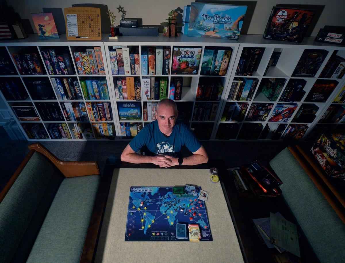 Steve Burrows is set up to play Pandemic at his home in Lee’s Summit.