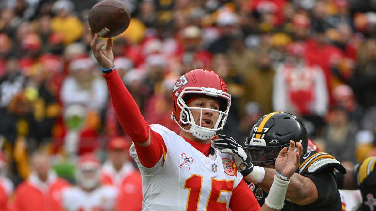 Kansas City Chiefs quarterback Patrick Mahomes (15) throws a pass while being pressured by Pittsburgh Steelers defensive tackle Cameron Heyward (97) during the first quarter at Acrisure Stadium.