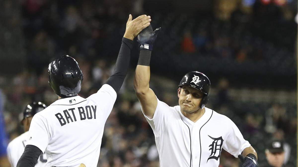 The Tigers’ Mikie Mahtook was greeted by the bat boy after Mahtook hit a two-run home run off the Royals’ Jason Hammel in the eighth inning on Saturday night in Detroit.