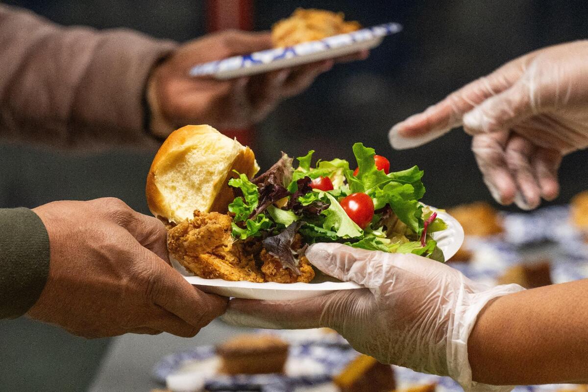 Hot, home-style meals are served by volunteers meals at the Gregg Klice Community Center in Kansas City on Giving Tuesday.