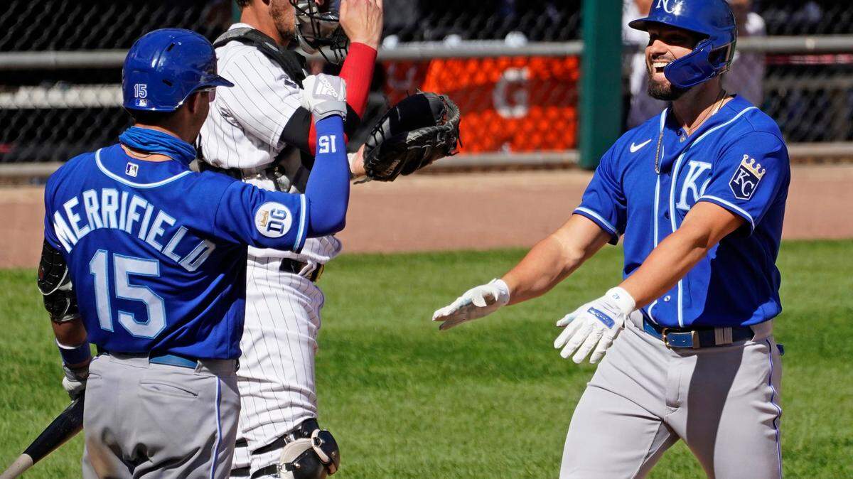 Kansas City Royals’ Ryan McBroom, right, smiles as he celebrates with Whit Merrifield after hitting a solo home run during the seventh inning of a baseball game against the Chicago White Sox in Chicago, Saturday, Aug. 29, 2020. (AP Photo/Nam Y. Huh)