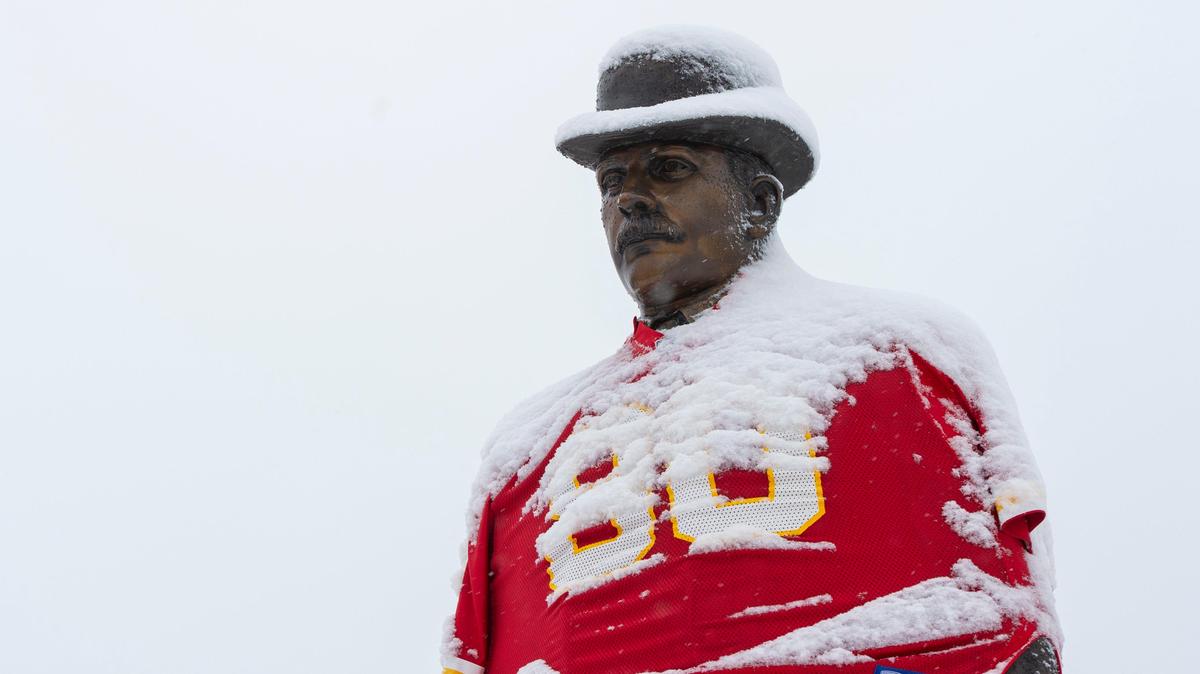Snow covered a statue of Overland Park founder William Strang, decked out in a Kansas City Chiefs jersey, in downtown Overland Park on Friday, January 24, 2020. A majority of school districts in the area were closed due to the snowfall.