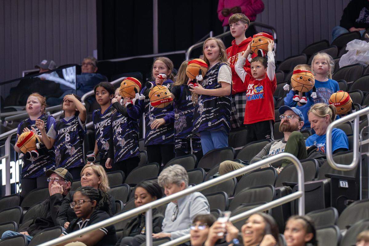 Children hold stuffed animal basketballs during a game between the Kansas Jayhawks and the UCF Knights in the third quarter of the Big 12 Women's Basketball Tournament at T-Mobile Center on Wednesday, March 4, 2026, in Kansas City.