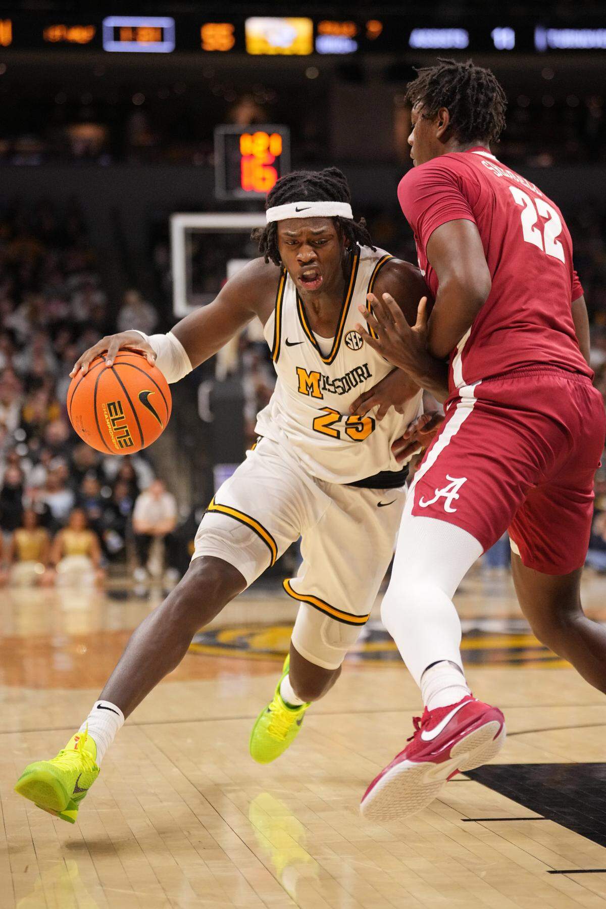 Missouri Tigers guard Mark Mitchell (25) dribbles the ball as Alabama Crimson Tide forward Aiden Sherrell (22) defends during the first half at Mizzou Arena on Feb. 19, 2025.