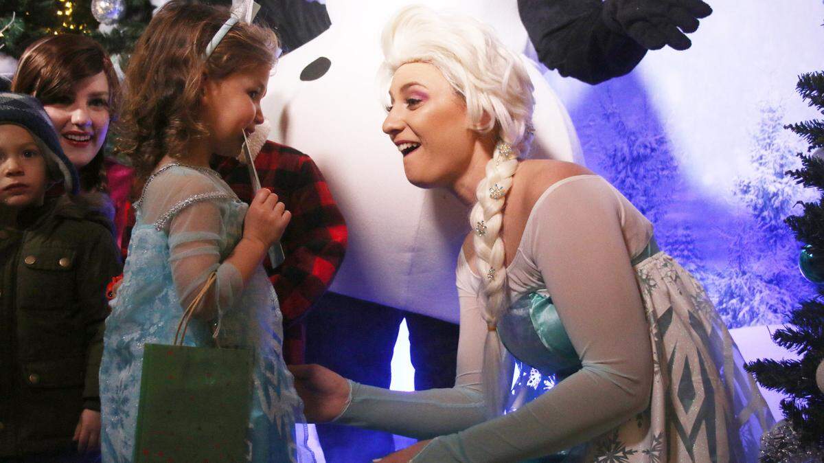 Addi Jean Small, 3, and Ashley Bosserman compare their Elsa costumes at the “Frozen” section of the Summit Park Church Christmas Adventure Dec. 13.