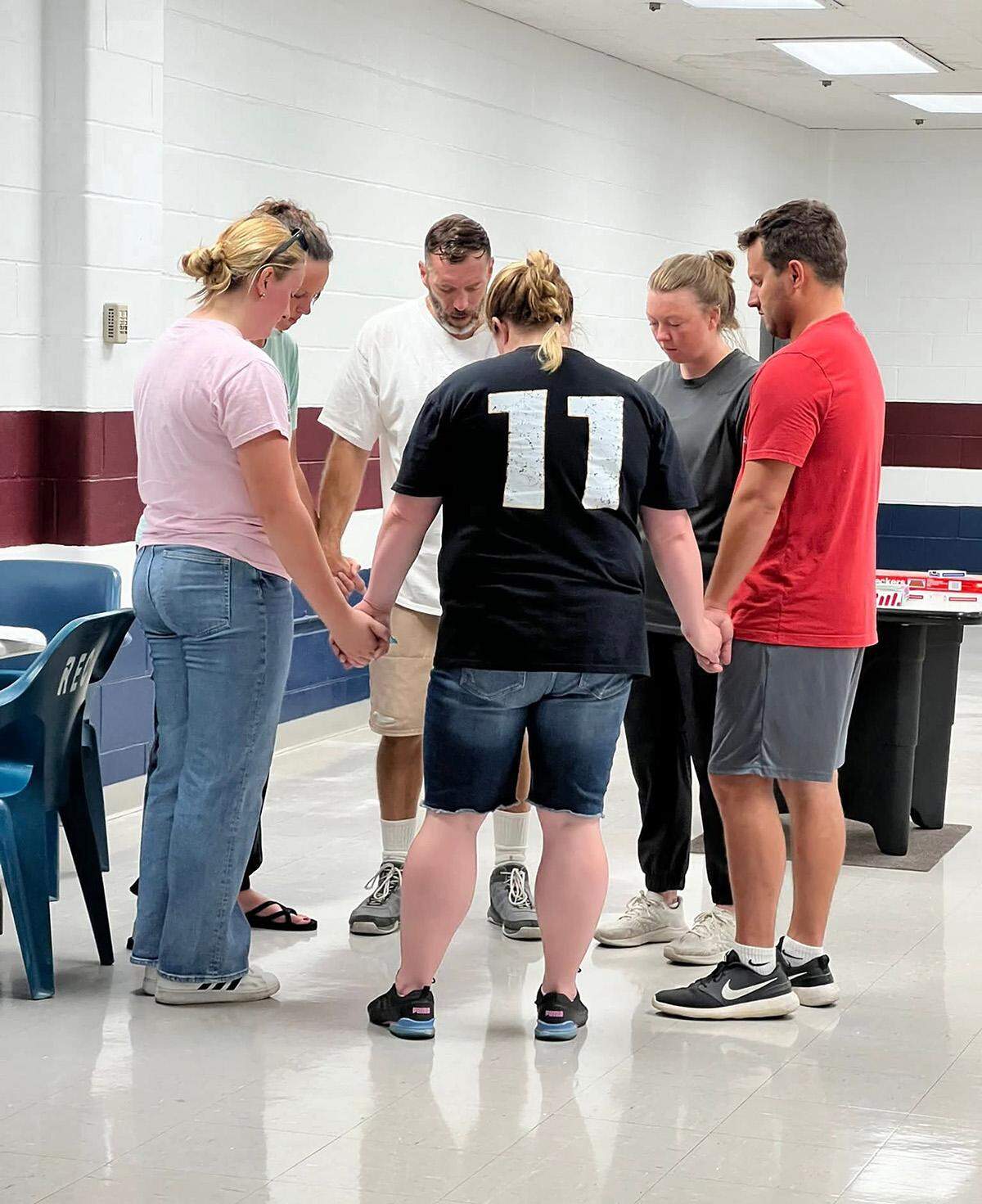 Lance Shockley, Summer Shockley and other relatives pray at Potosi Correctional Center in 2025.