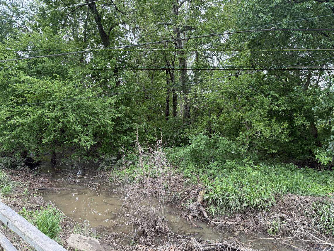 Debris beyond trail barriers at Leawood City Park
