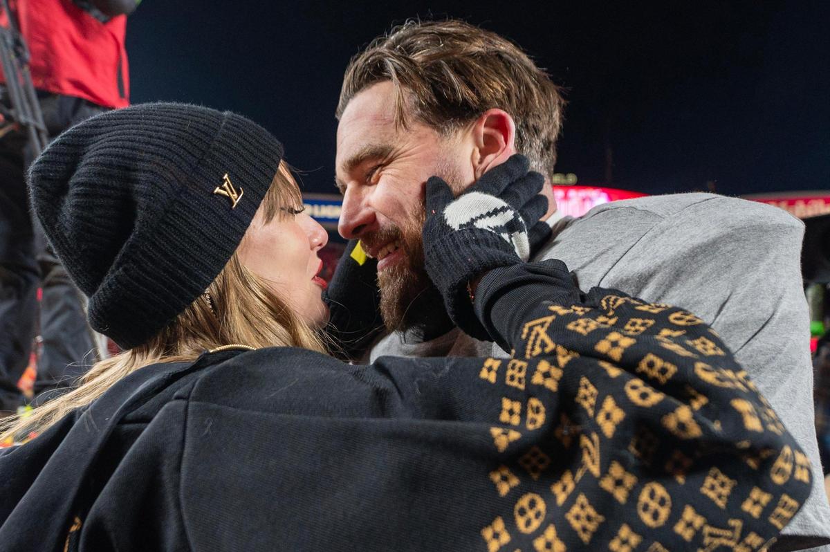 *Pop star Taylor Swift embraces Kansas City Chiefs tight end Travis Kelce (87) after the trophy ceremony following the Chiefs’ 32-29 victory over the Buffalo Bills in the AFC Championship Game on Sunday, Jan. 26, 2025, at GEHA Field at Arrowhead Stadium.