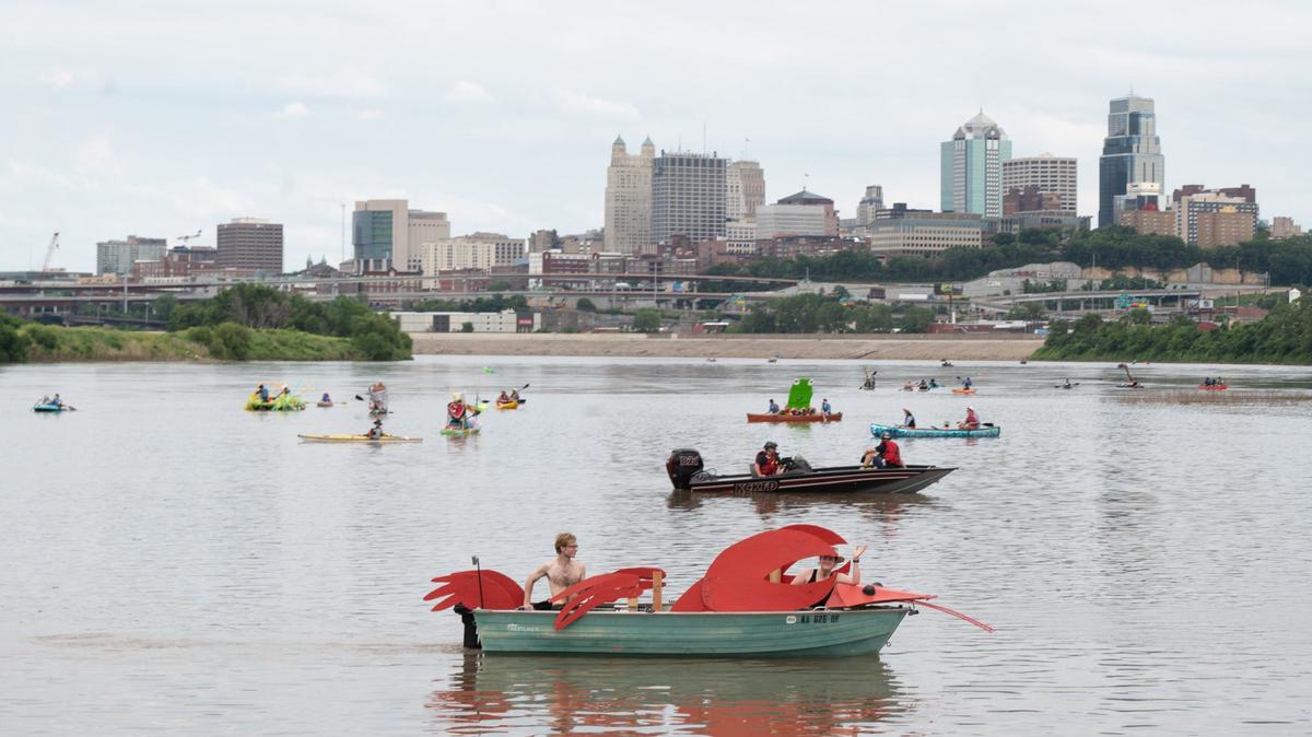 Decorated boats in the Kawsmouth River Carnival boat parade float down the Missouri River on Saturday, June 8, 2024.