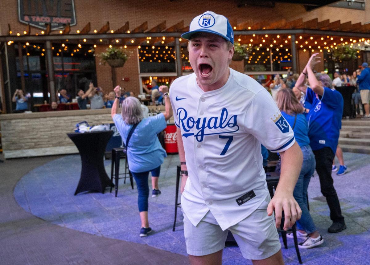 Royals fans including Tommy Dunn of Overland Park celebrate at the Kansas City Power & Light District as the Royals defeated the Baltimore Orioles, 2-1, to win the Wild Card series in Balitmore on Wednesday, Oct. 2, 2024. The Royals advance to the ALDS, where they will face the Yankees in New York on Saturday.