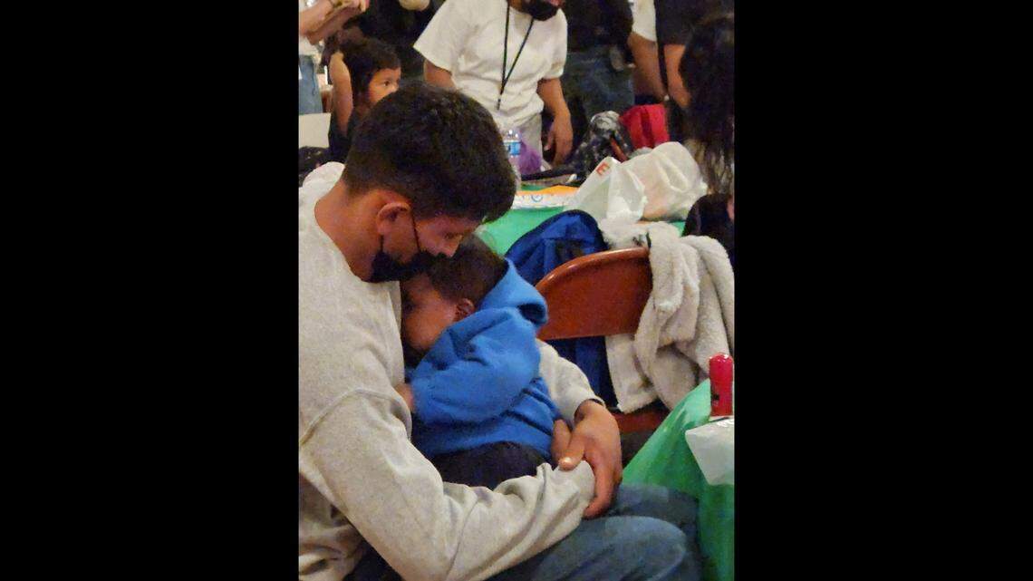 Families seeking asylum in the United States gather in a Kansas City church to receive food and medical aid, while awaiting word from their sponsors.