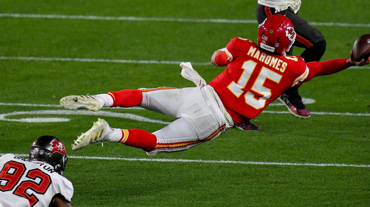 After being pressured by Tampa Bay Buccaneers defensive end William Gholston, Kansas City Chiefs quarterback Patrick Mahomes gets a pass off while falling in the fourth quarter of the Kansas City Chiefs game against the Tampa Bay Buccaneers in Super Bowl LV at Raymond James Stadium in Tampa, Sunday, Feb. 7, 2021. The Buccaneers defeated the Chiefs 31-9.