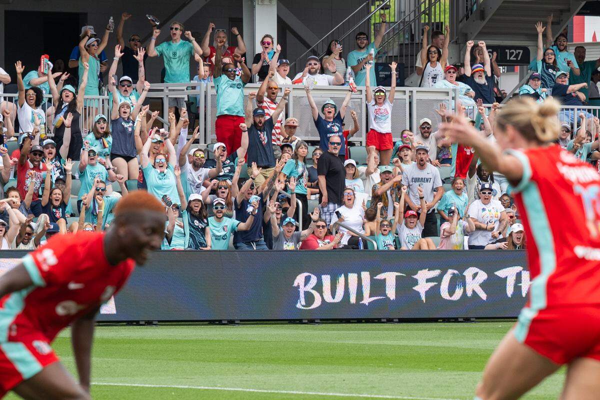 Fans celebrate a goal by KC Current forward Temwa Chawinga during the second half of an NWSL soccer match against the Boston Legacy on Saturday, May 30, 2026 at CPKC Stadium in Kansas City. KC won 1-0.