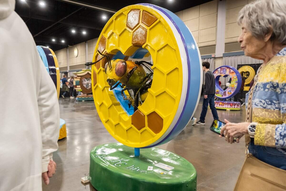 A heart shaped as a honey comb, complete with a bee in the center, on display during the first public exhibition of the new Parade of Hearts sculptures on Saturday, April 4, 2026, in Overland Park.