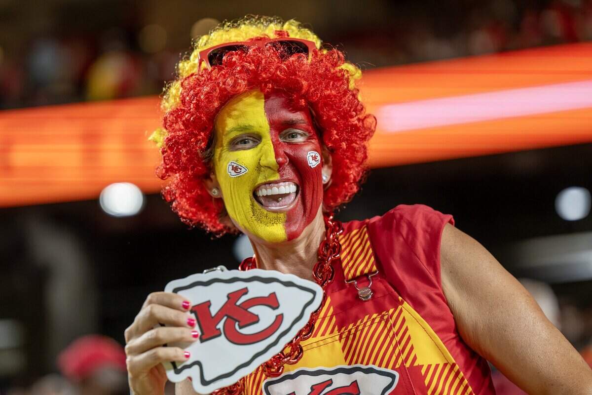 A fan cheers during the season opening game between the Kansas City Chiefs and Denver Broncos at Arrowhead Stadium Monday, Sept. 14, 2026, in Kansas City.