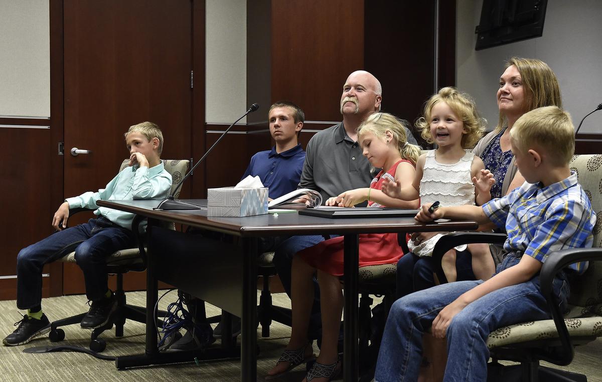 It’s a happy ending for the five siblings featured on The Star’s “Family Wanted” installments who wanted to be adopted together. The Fab Five, three boys and two girls between the ages of 3 and 12 were officially adopted by Toni and Jeff Whaley in Judge Kathleen Sloan’s Johnson County courtroom Wednesday. The family, Preston (from left), Bradley, dad Jeff Whaley, Layla, Olive, mom Toni and Landon listen to the judge during the proceedings.