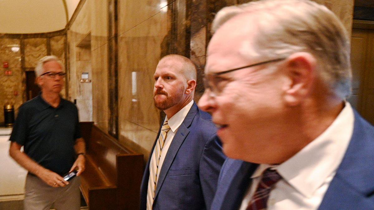 Britt Reid, center, walks to a courtroom with his attorney J.R. Hobbs, right, Monday, Sept. 12, 2022, at the Jackson County Courthouse to plead guilty to a drunk driving charge. The former assistant coach and son of head coach Andy Reid pleaded guilty to driving while intoxicated and causing a 2021 crash that severely injured a 5-year-old girl.