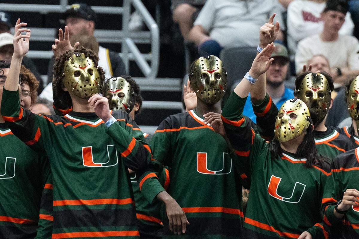 The Miami Hurricanes band wears hockey masks and chant in the second half of the Tigers first-round NCAA Tournament matchup vs. the Miami Hurricanes at Enterprise Center in St. Louis on Friday, March 20, 2026.