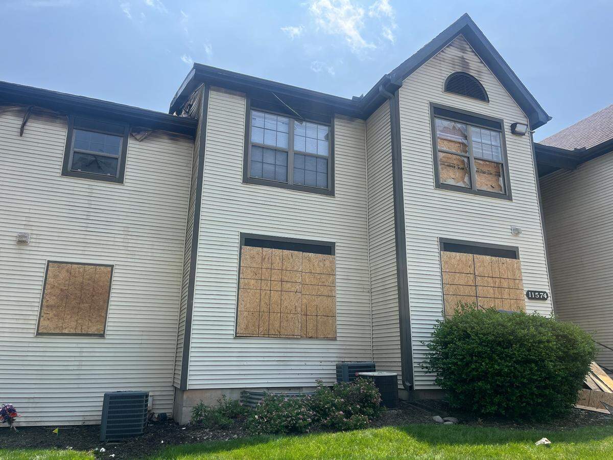 Crews were seen boarding up entrances and windows to a Coach House apartment building, located in the 11500 block of Holmes Road in South Kansas City, on Monday, June 2. The cause of the fire, which occurred late Sunday night, is under investigation by the Bomb and Arson Unit of the Kansas City Police Department.