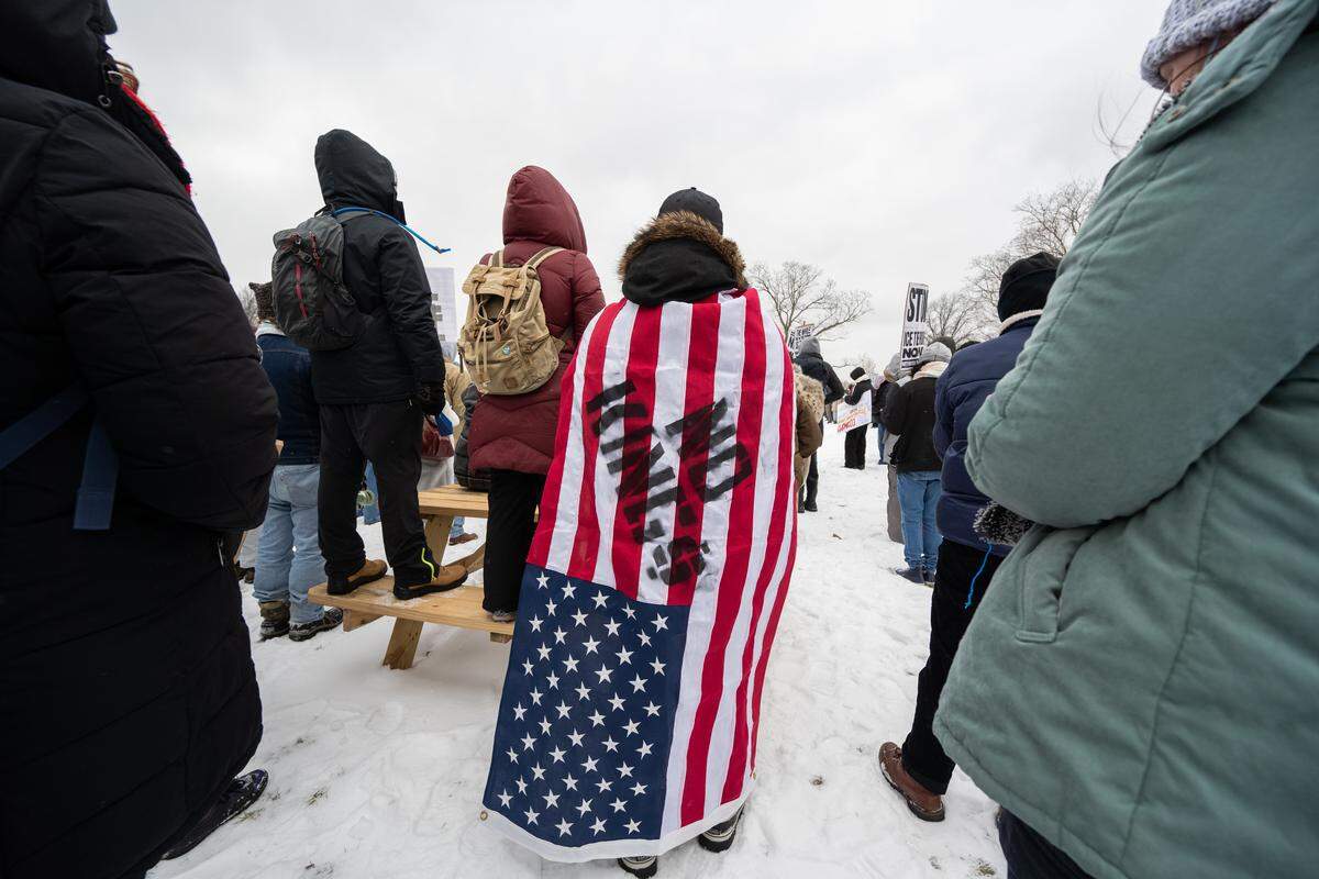 Protesters gathered at the World War I Museum and Memorial to rally against recent ICE actions across the U.S. and in Kansas City on Friday, Jan 30.