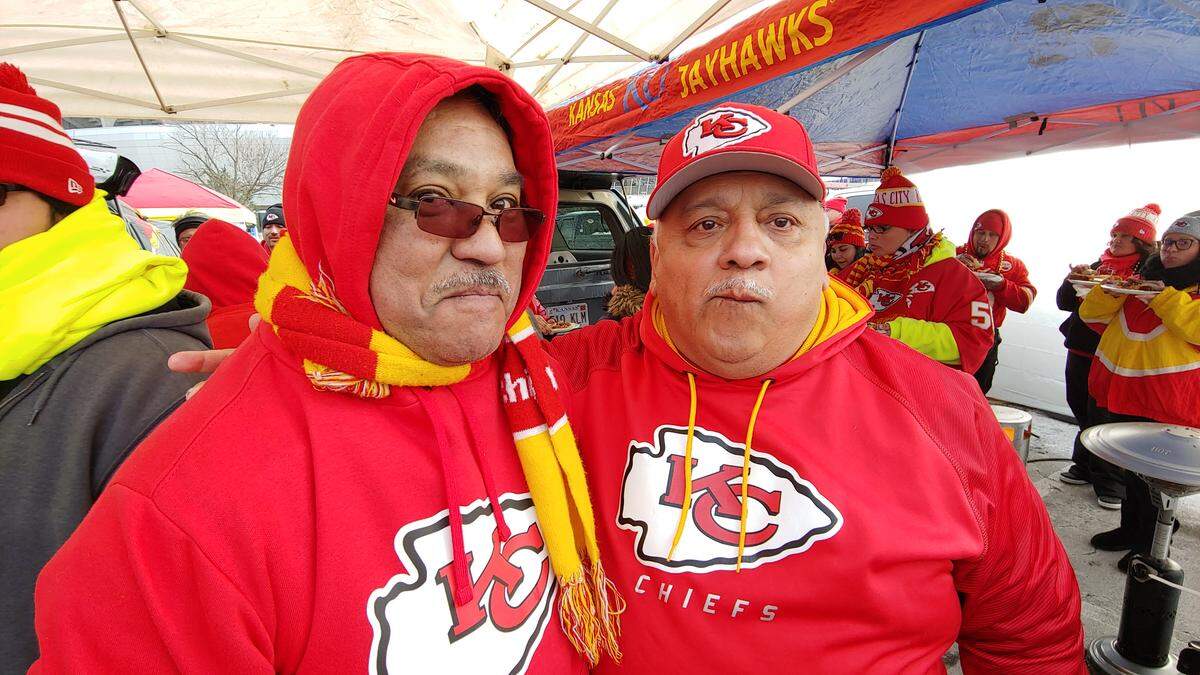 David Tinoco, left, and Mike Hernandez, tailgating before Sunday’s AFC Championship Game, have been faithful ticket holders at Arrowhead for more than 30 years.